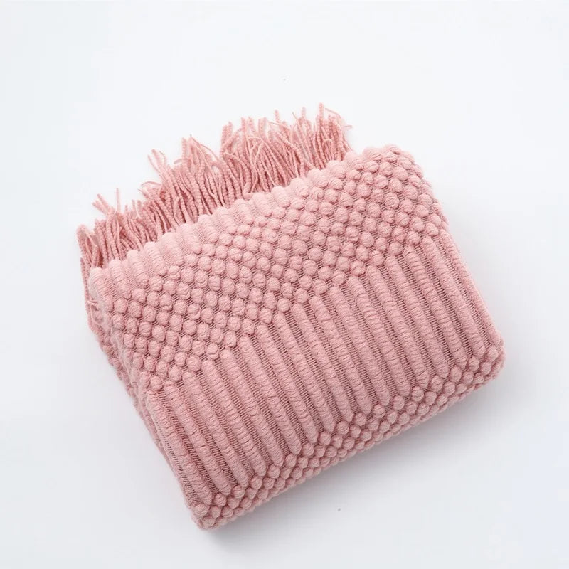 Plaid tricoté à franges rose, plié