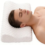 Oreiller ondulé à mémoire de forme vu de dessus, avec un dormeur
