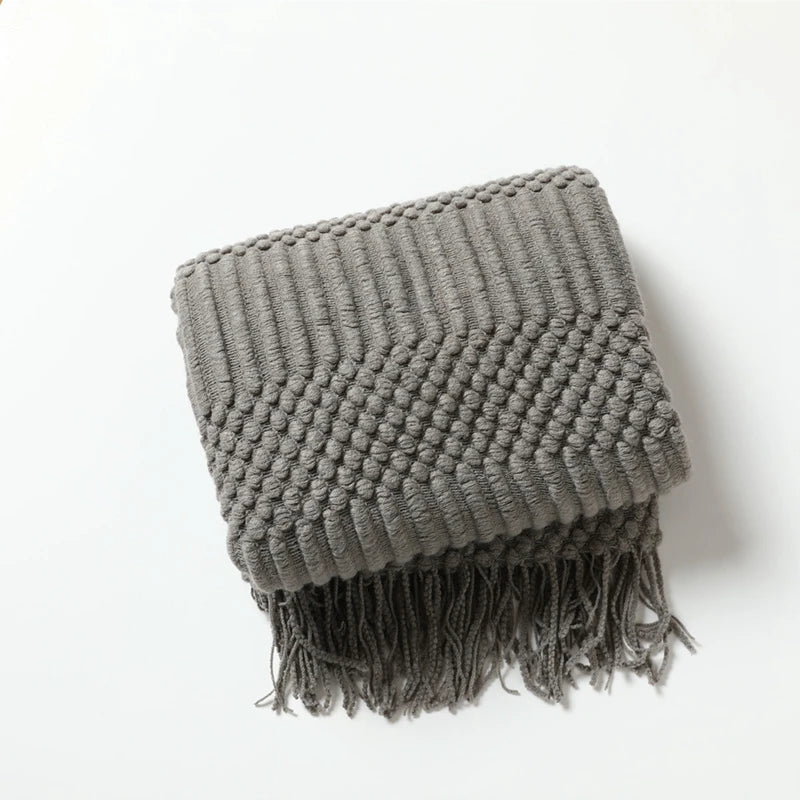 Plaid tricoté à franges gris anthracite, plié