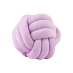 Coussin nœud en velours lilas sur fond blanc
