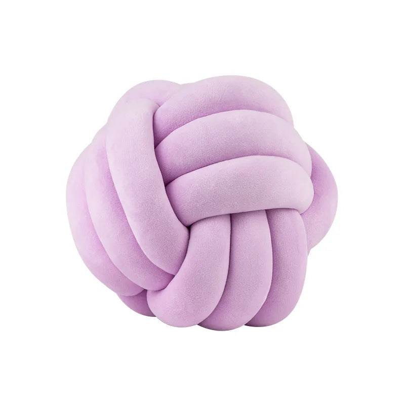 Coussin nœud en velours lilas sur fond blanc