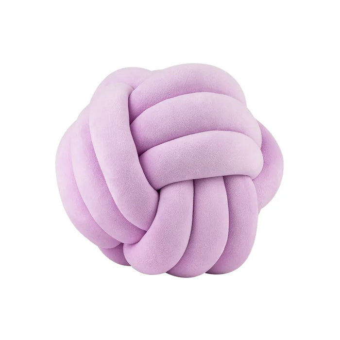 Coussin nœud en velours lilas sur fond blanc